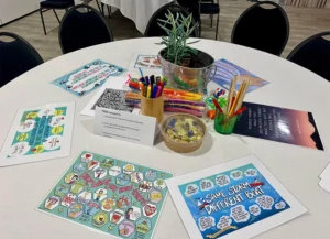 Table with Dr Karen Treisman's worksheets at a public training event